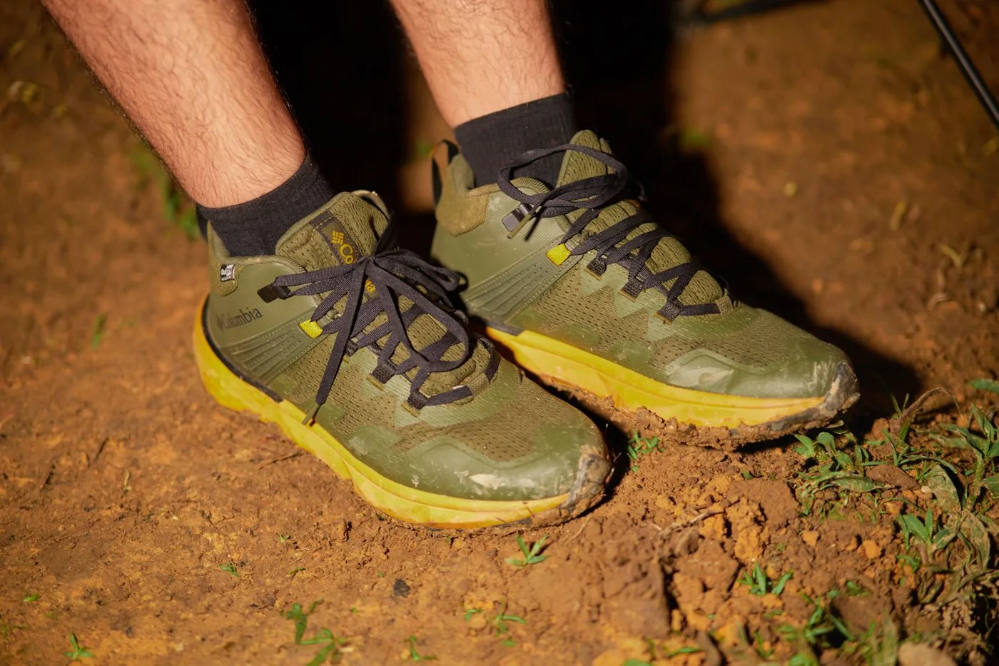 Green walking shoes with textile panels.