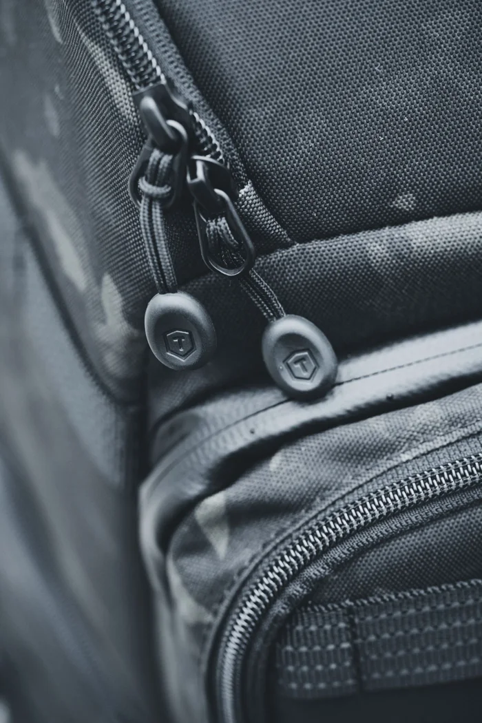 A backpack zip and outer pocket.