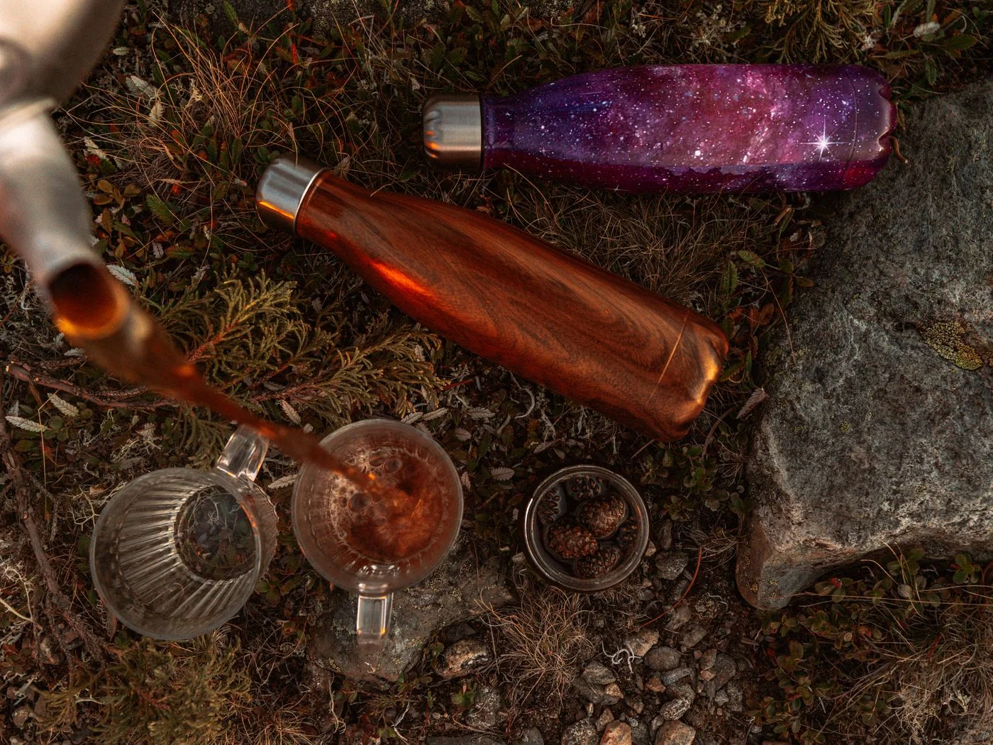 Flasks and a drink during an outdoor break.