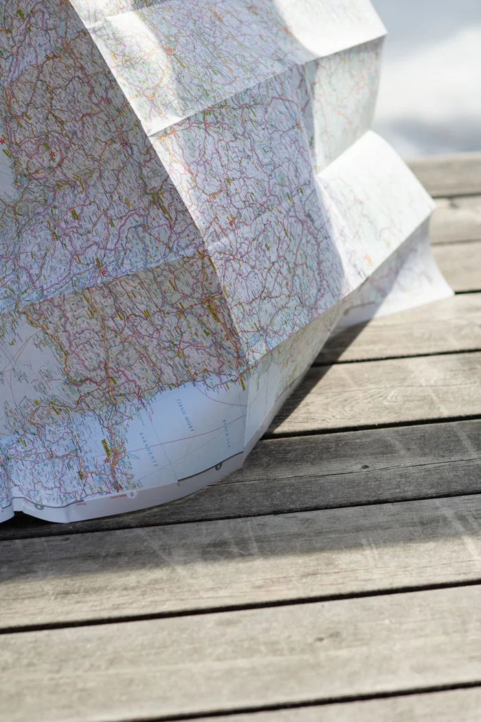 An unfolded paper map on a table.