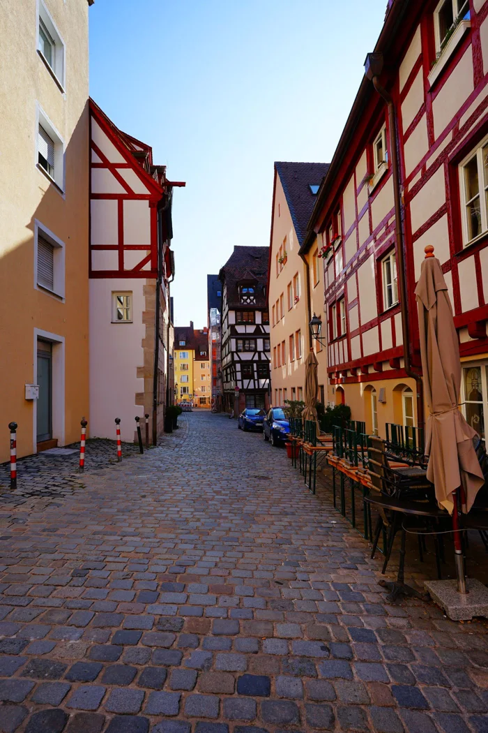 Cobblestones and timber-framed houses in an old town.